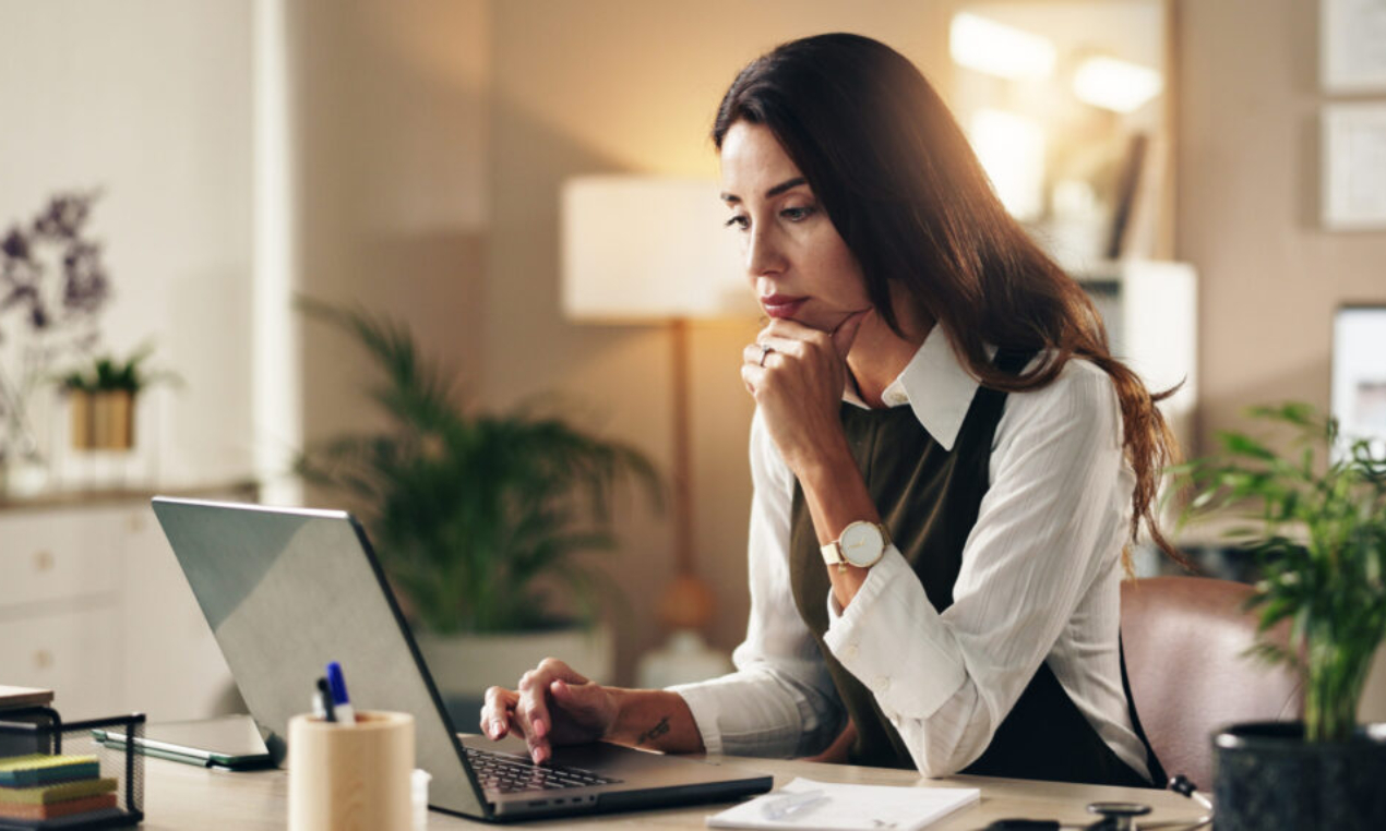 Woman, doctor or thinking in office with laptop, online consultation or healthcare research. Mature.