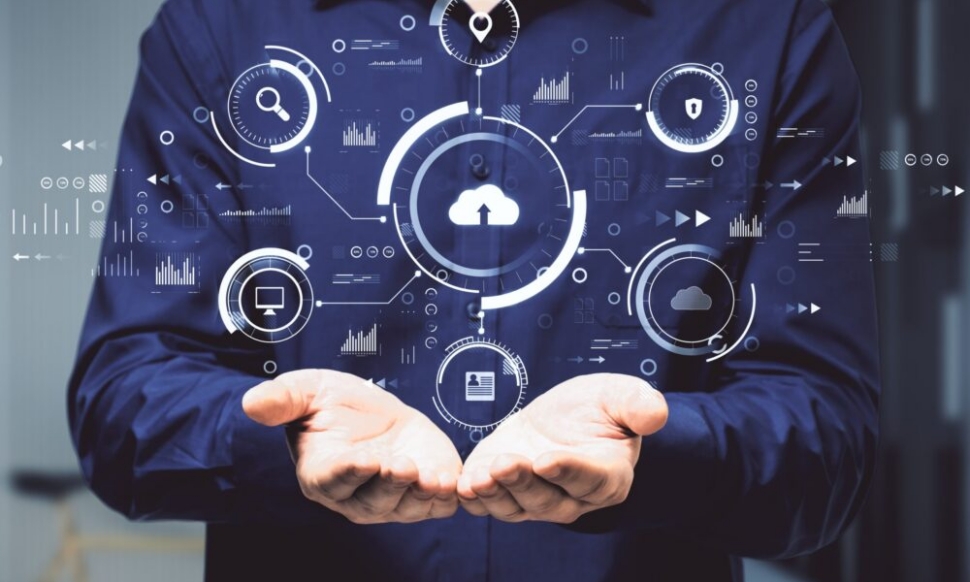 Hands holding abstract digital business interface symbolising cloud-native ERP and AI-driven insight for UK businesses